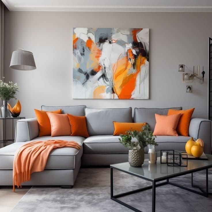 Light-grey sofa with burnt-orange accents and gallery art wall - bespoke joinery by Royalwoods Interiors, Nairobi