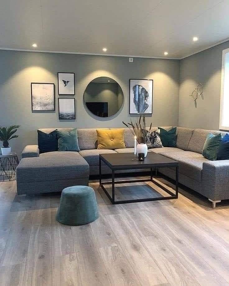 Corner sectional lounge with round mirror and teal accent cushions - bespoke joinery by Royalwoods Interiors, Nairobi