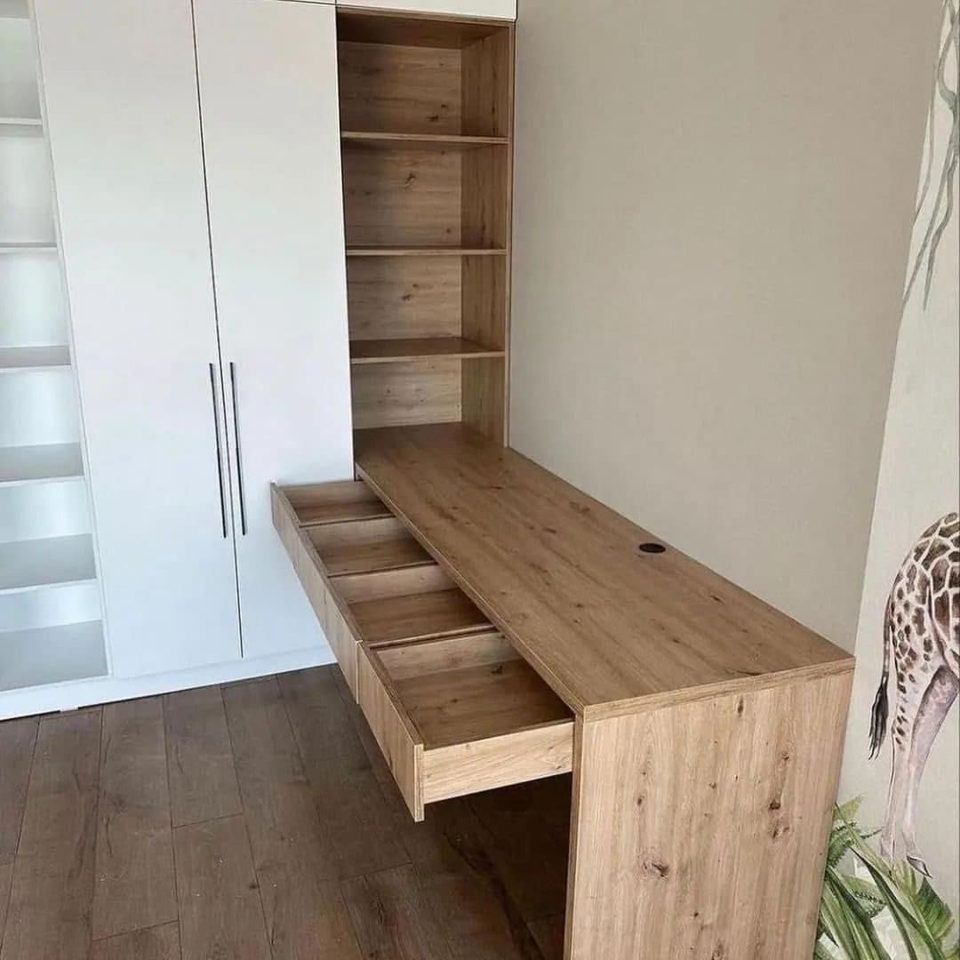 Detail: oak pull-out desk and dovetailed drawer inside a fitted wardrobe - bespoke joinery by Royalwoods Interiors, Nairobi