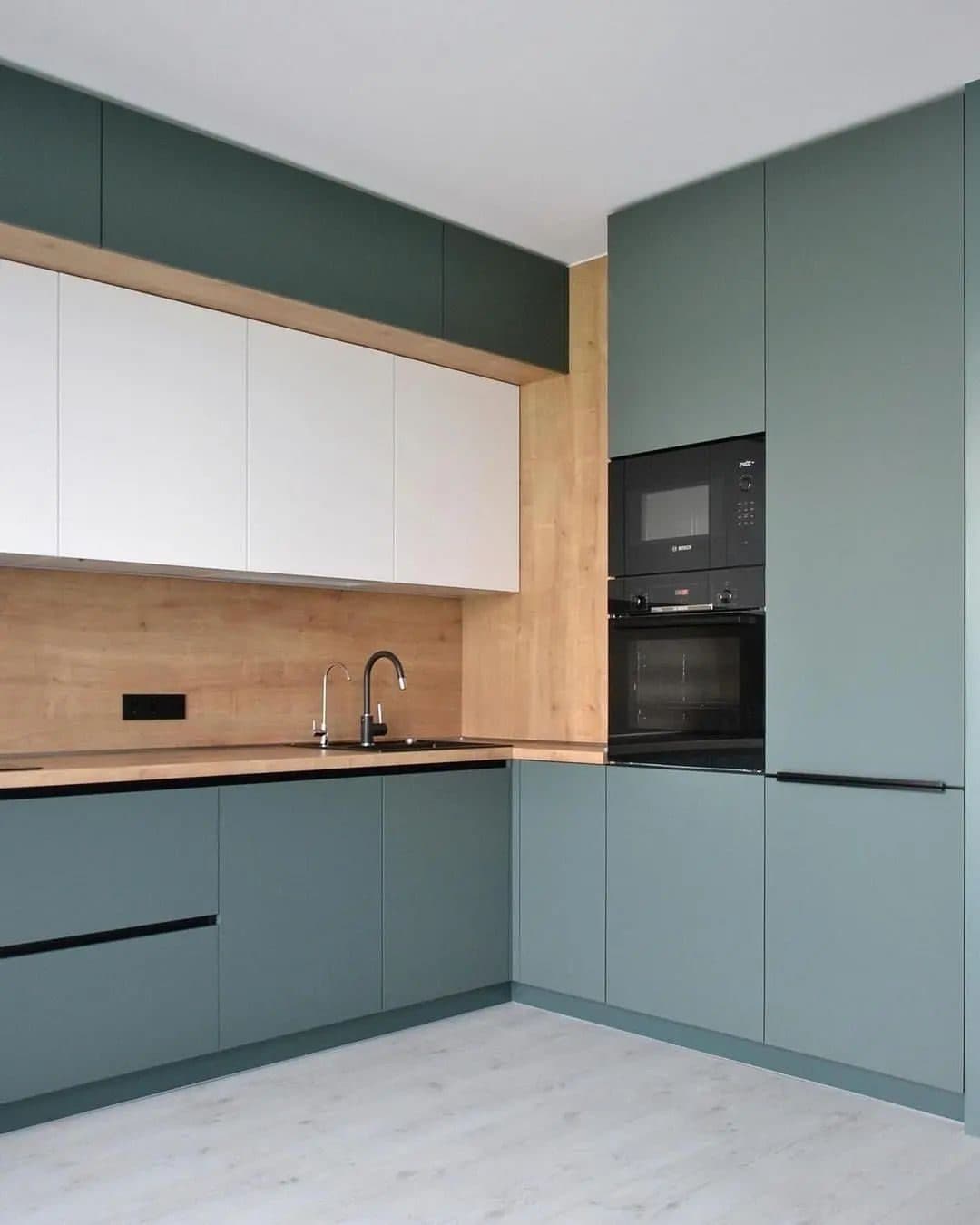 Sage kitchen elevation with integrated ovens and full-height larders - bespoke joinery by Royalwoods Interiors, Nairobi