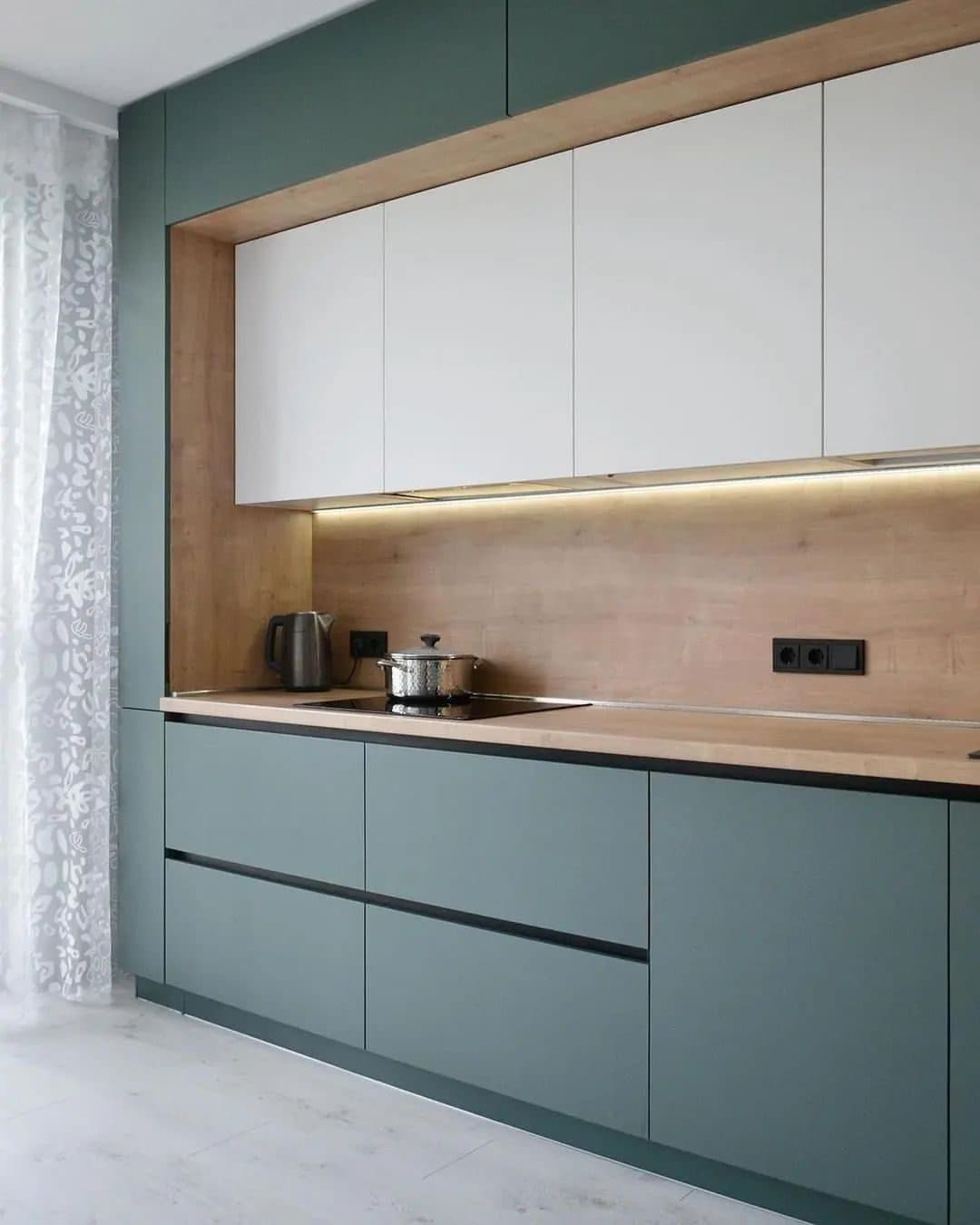 Sage and white matte kitchen with timber splashback and under-cabinet lighting - bespoke joinery by Royalwoods Interiors, Nairobi