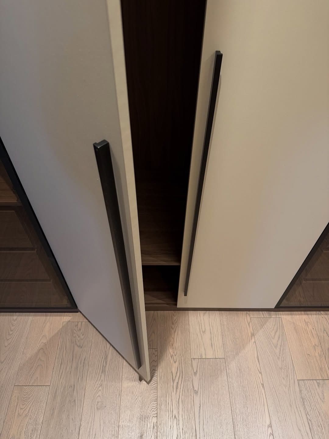 Detail: chamfered handle-less door edge, a signature Royalwoods profile - bespoke joinery by Royalwoods Interiors, Nairobi