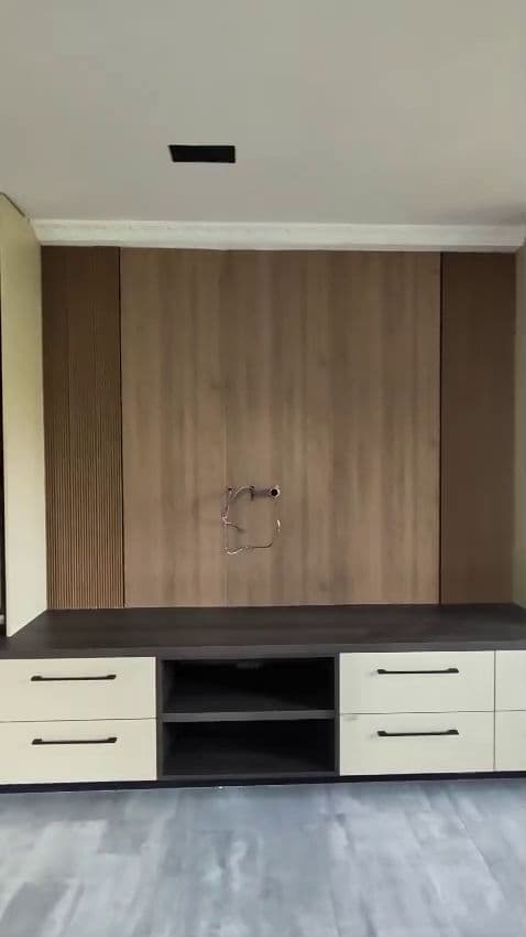 Walnut media wall with cream drawer bank by Royalwoods Interiors, Nairobi