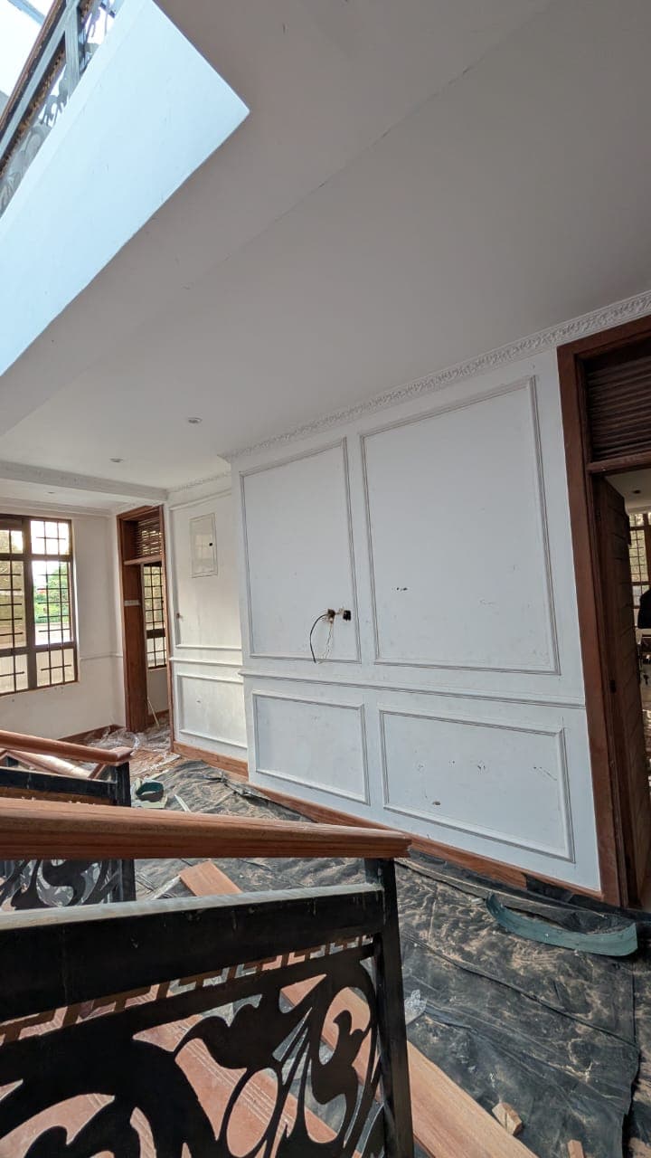 Private study with floor-to-ceiling painted panelling