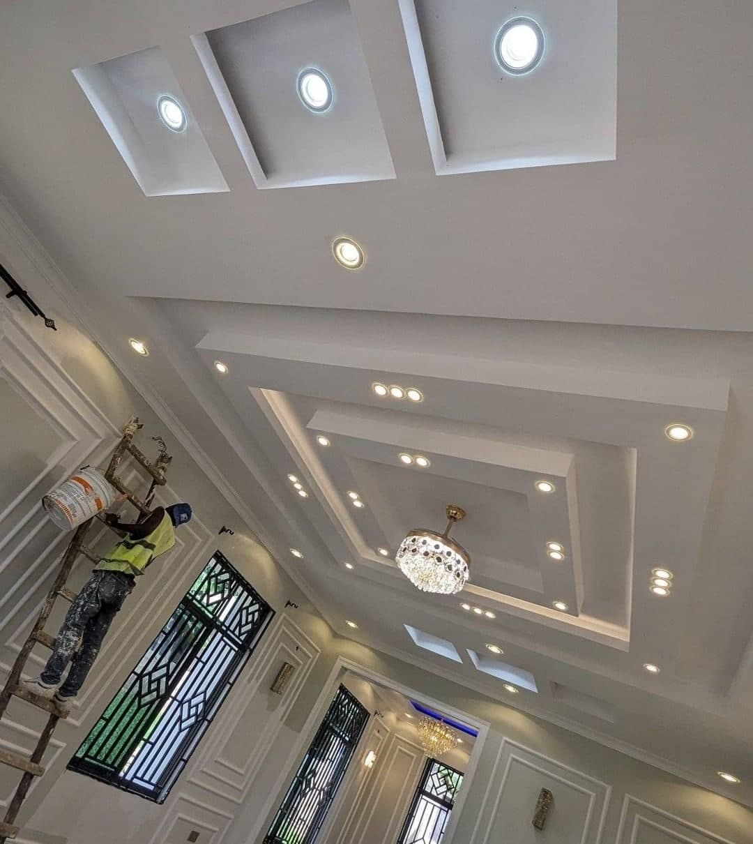 Layered gypsum ceiling composition seen from below, mid-finish, Nairobi