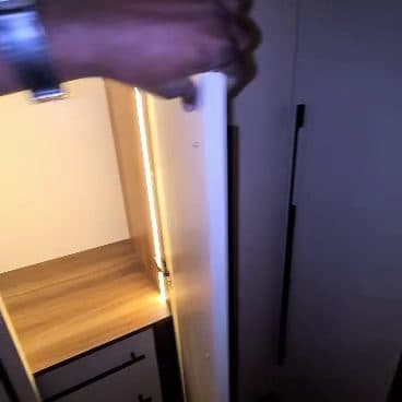 Warm strip lighting inside every hanging section, so the wardrobe works at 5am as well as at noon. — Royalwoods Interiors, Nairobi