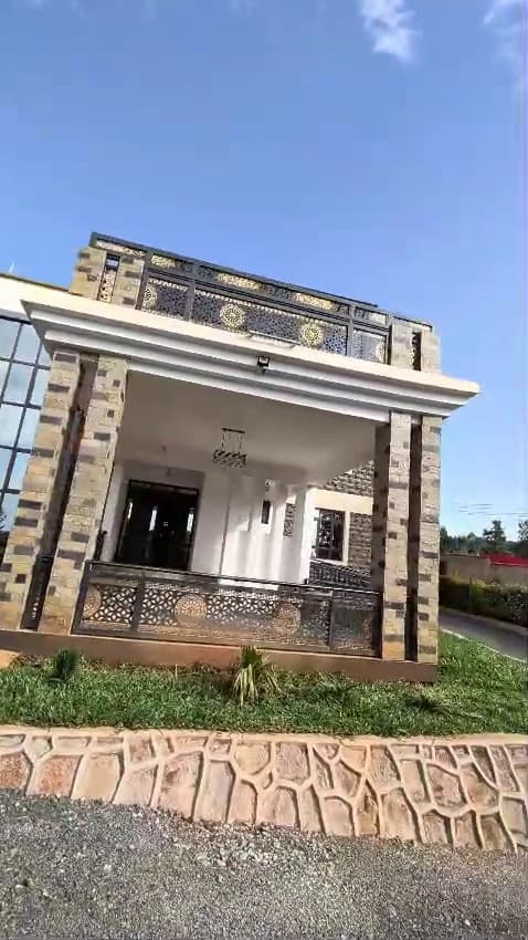 Full-height glazing, a steel pergola and a gravel forecourt — Royalwoods Interiors, Nairobi