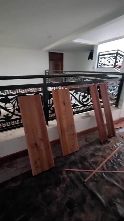 Offcuts on the floor, balustrade in, skirting next — Royalwoods Interiors, Nairobi