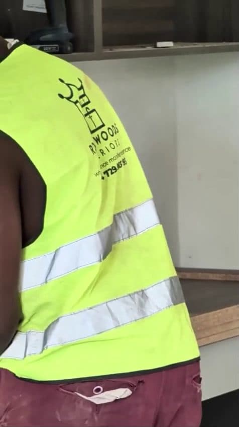 Our own craftsman, in our own hi-vis, fitting our own joinery. Nothing here is subcontracted. — Royalwoods Interiors, Nairobi