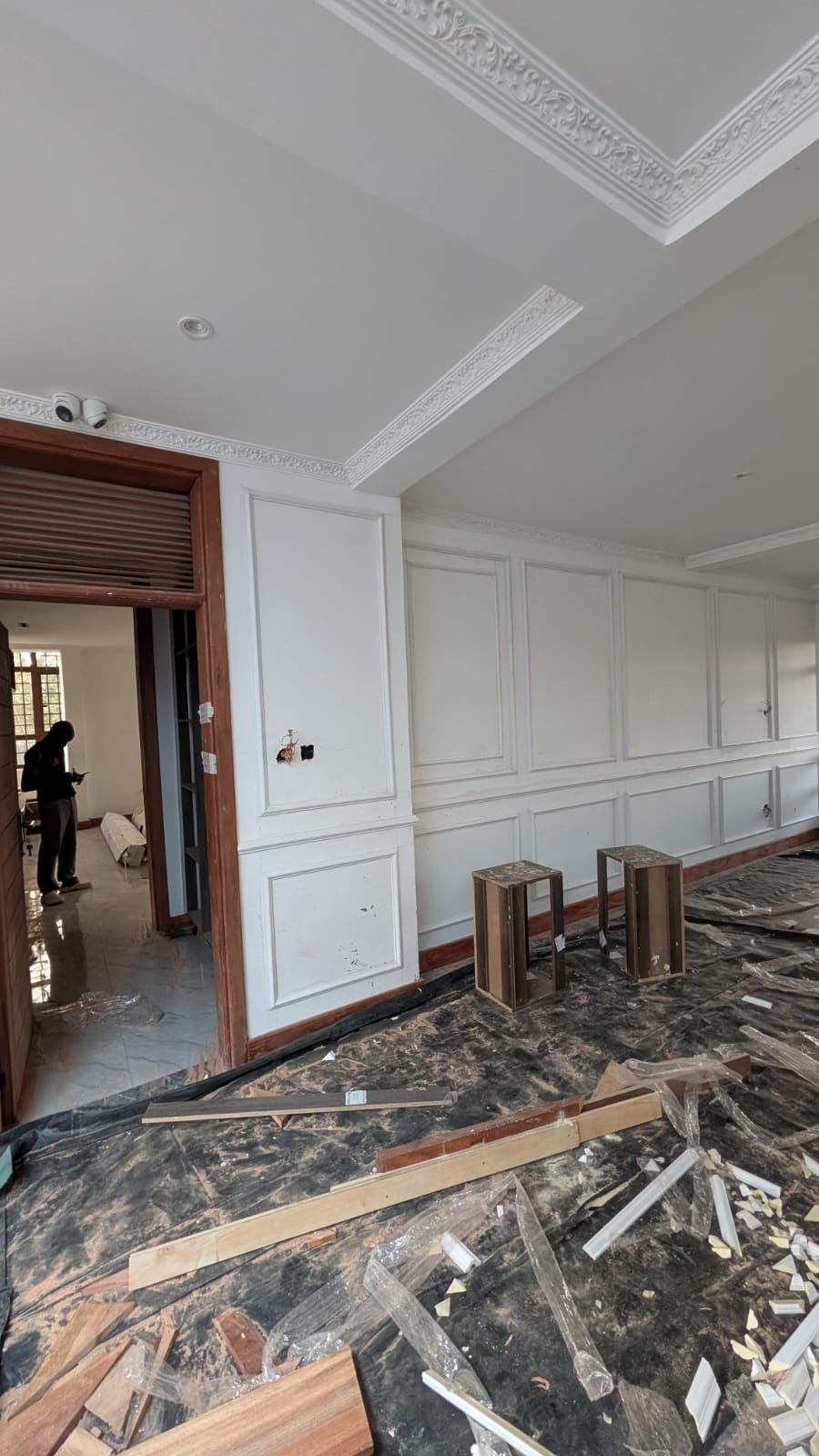 Executive lounge with ornate ceiling cornice and panelled walls